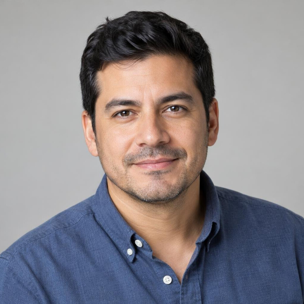 Portrait of a man with short hair smiling