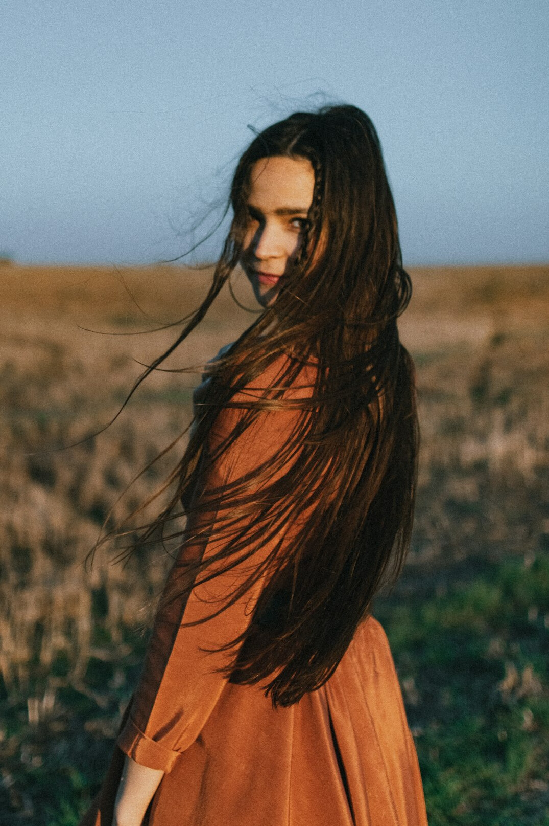 Portrait of a woman with long brown hair
